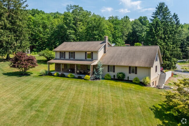 Farmhouses in Forrestville generally have acres of land with long driveways.