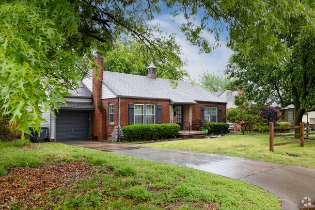 Mature trees surround a beautiful home in the Fair Heights neighborhood.