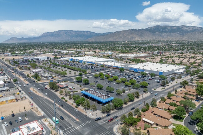 Retail centers line Eubank Boulevard with mountain views beyond South Los Altos.