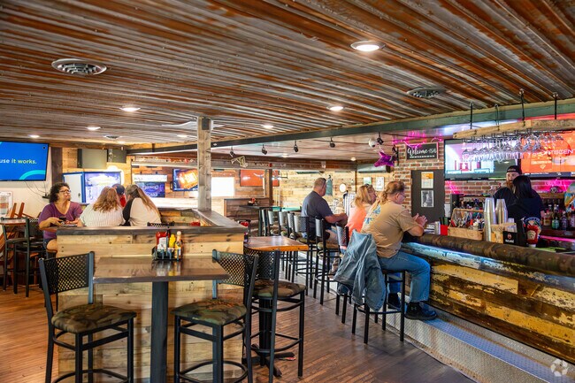 After a day of work in Pittsville, family and friends meet at the Oasis Bar & Grille.