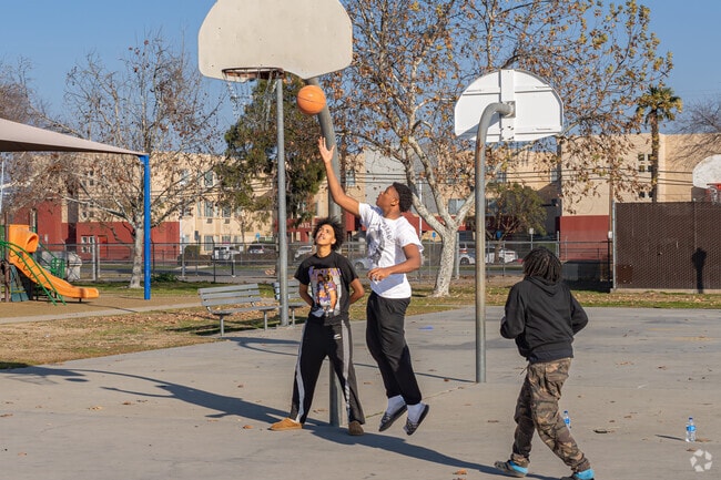 Lakeview friends enjoy playing a game of hoops at Lowell Park after school.
