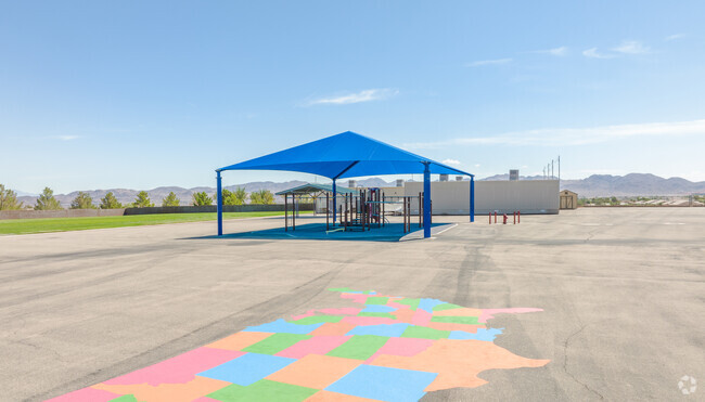 Colorful map and covered playground in James E & A Rae Smalley Elementary School.