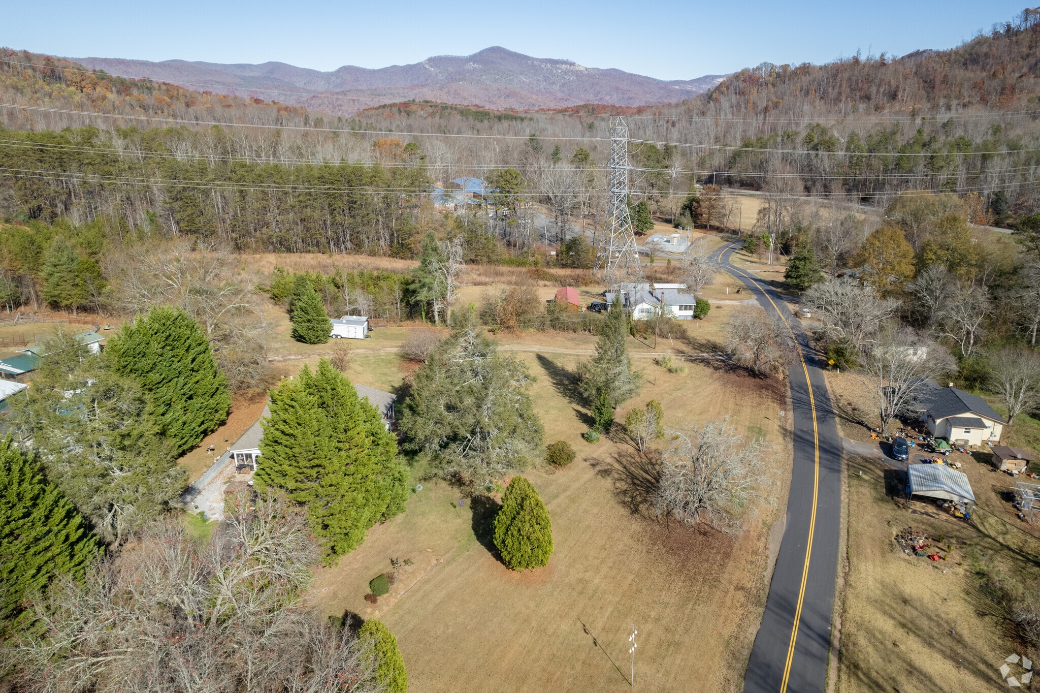 An aerial overview of Holly Springs surrounded by a mountain range.