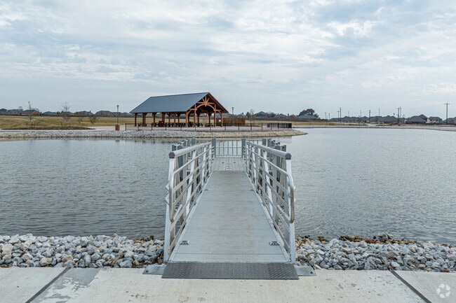Anglers enjoy the serene pond at Eula Umphress & Robert Hynds Park.