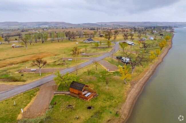 Families head to Farm Island in Pierre for lakeside camping.
