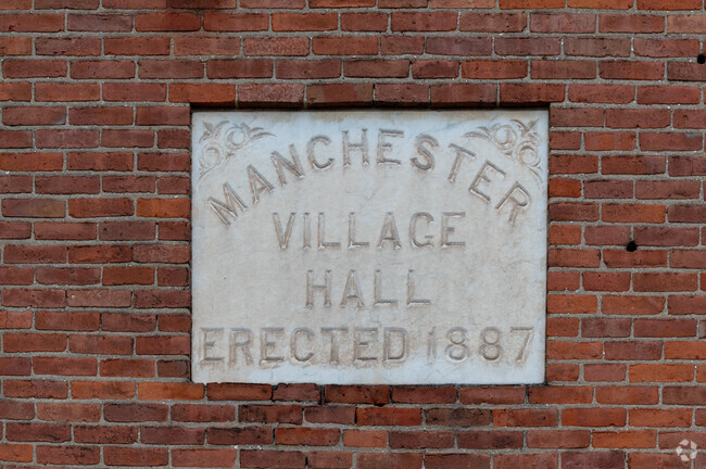 The historic Manchester Village Hall was erected in 1887 and has been repurposed as an office.