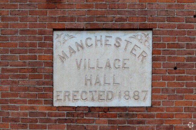 The historic Manchester Village Hall was erected in 1887 and has been repurposed as an office.
