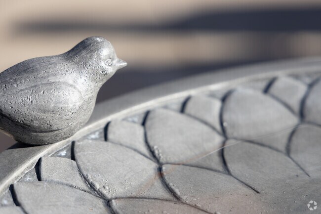 Acadian Village homes often have artistic yard features and accents.
