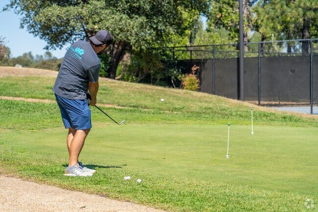 Residents enjoy golf at Auburn Lake Trails’ nine-hole course.