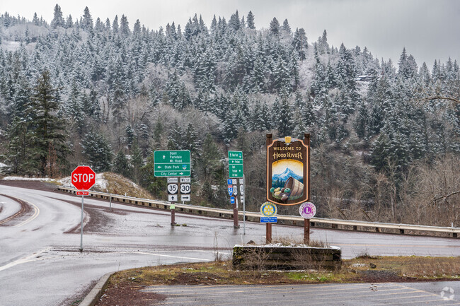 Signage and snowy hills welcome you as you enter the city of Hood River.