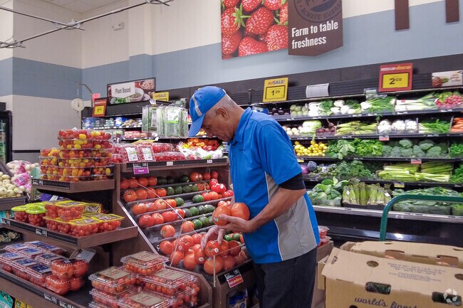 A Food Lion employee ensures that the very best produce is available in Poquoson West.