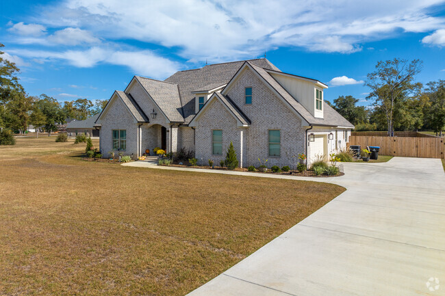 A beautiful contemporary shed-style home that is a popular design in Outer West Mobile.