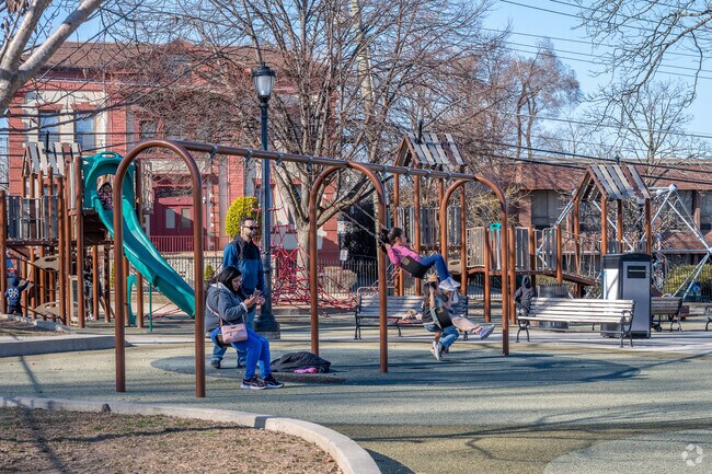 New Rochelle families enjoy the playground at Lincoln Park and Pool.