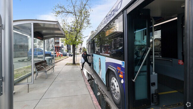 A woman exits a bus in Livermore, illustrating the city's accessible public transit.