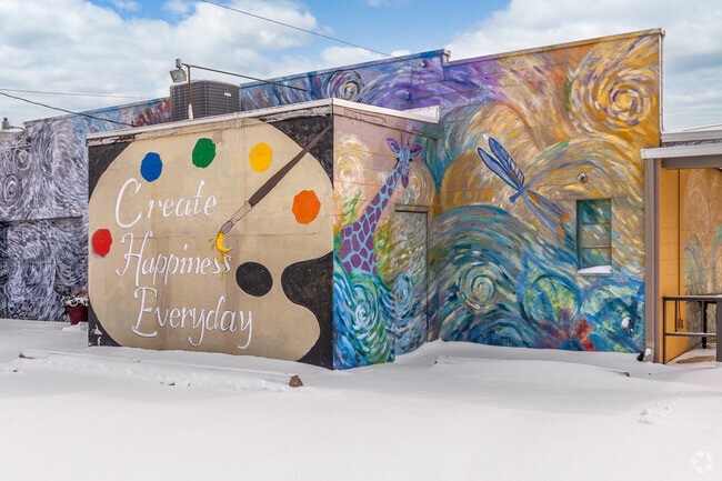 Many murals result from collaborations between local artists, businesses, and nonprofits, reflecting a shared civic spirit like this colorful mural located at Gallery 2: Ten.