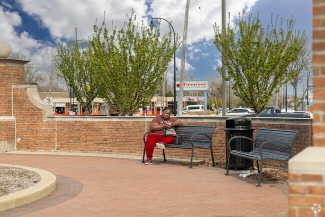 This local enjoys the sun while relaxing on a park bench in the Clements Circle neighborhood.
