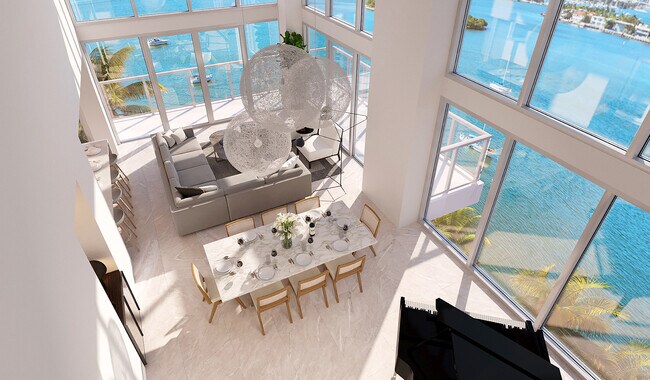 Double-height windows usher in fantastic Biscayne Bay views.