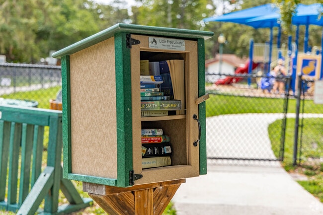 Enjoy a good book while relaxing under the oak trees at Arlington Park.