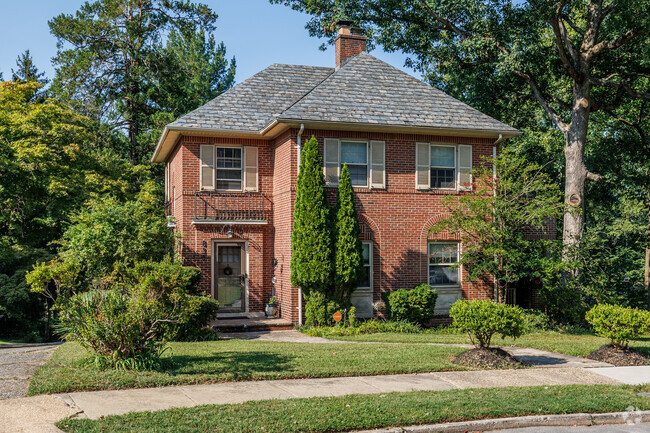 Hunting Ridge homes come in many styles, like this brick Colonial.