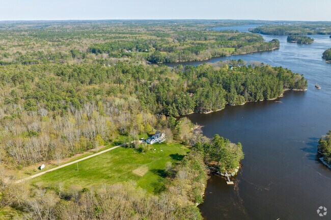 Aerial photo of an antique New Englander home along the Kennebec River in Woolwich, Maine.