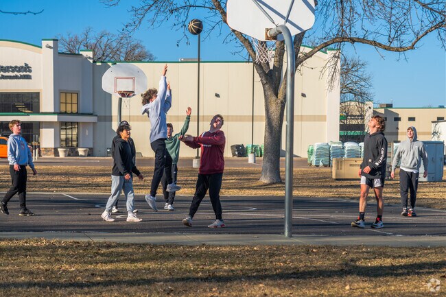 The local teens come together at Central park for some outdoor basketball.