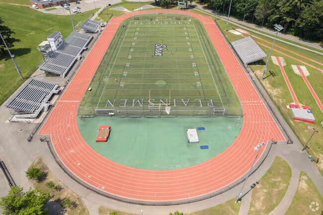 Clifton Park locals cheer on the home team at Shenendehowa High School's football field.