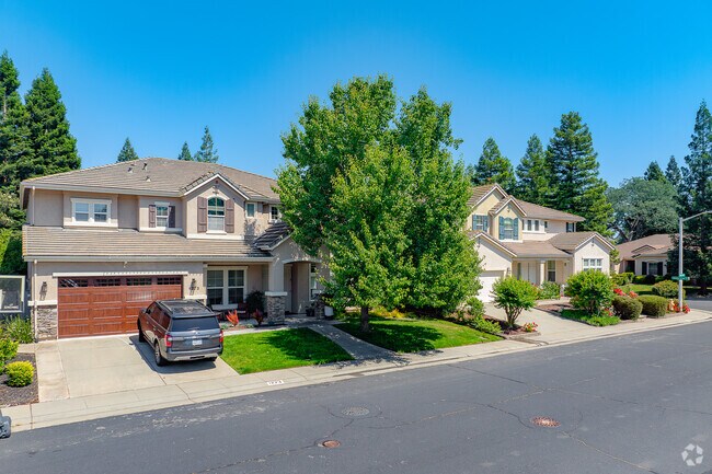 Row of slightly spanish influenced two story homes sit peacefully in Cirby Side.