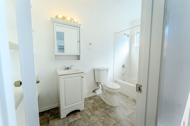 Bathroom with new toilet and tub
