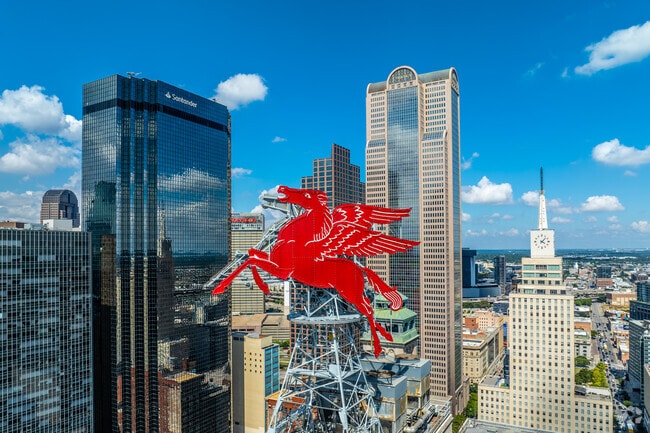 Pegasus the flying red horse, shines as a vibrant icon from atop Magnolia Downtown Dallas.