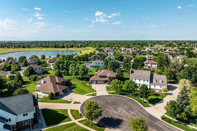 Centennial from above is a tapestry of parks, lakes, and modern architecture.