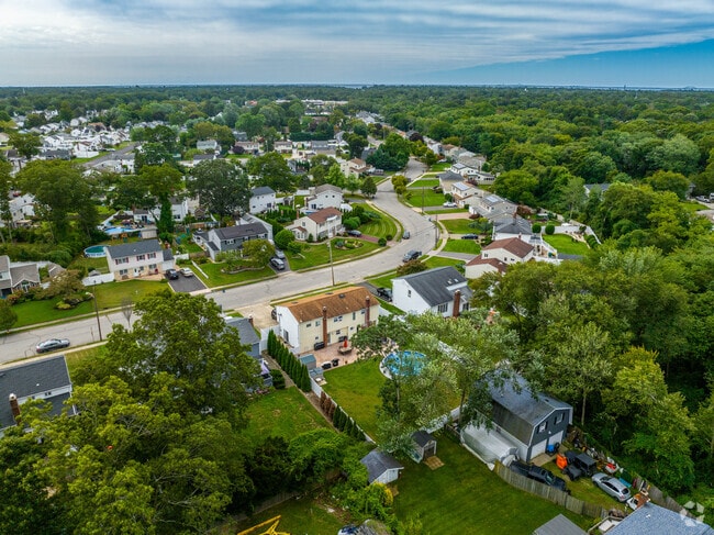 Quiet residential roads weave through Islip Terrace.