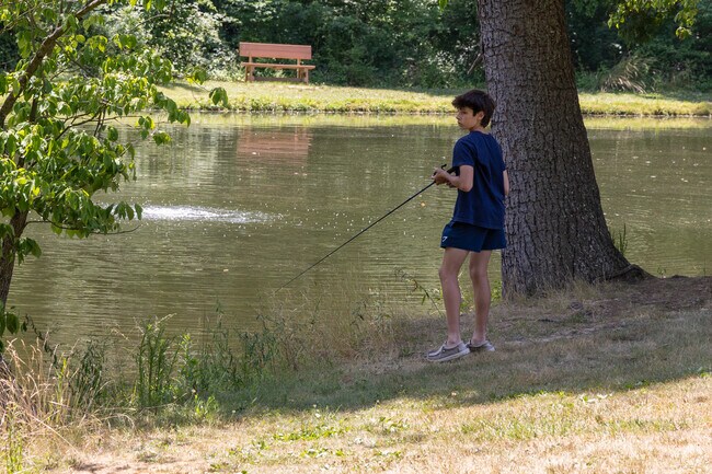 Locals enjoy fishing at the pond in Dowlin Forge Park.