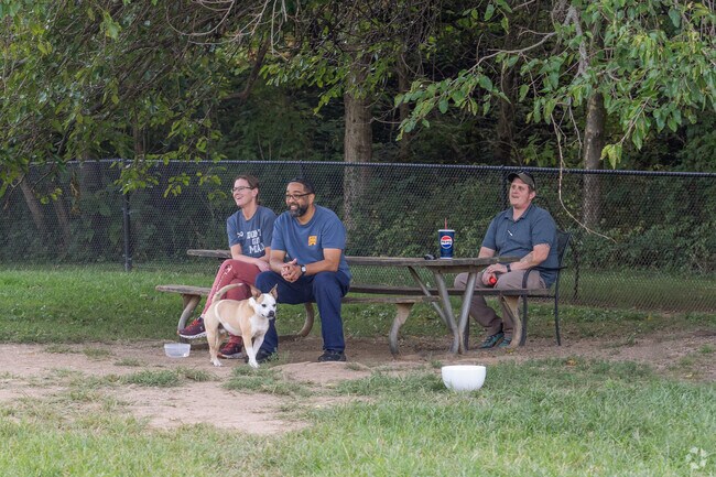 Glade Creek Dog Run features a spacious, fenced area where dogs can run freely and play.