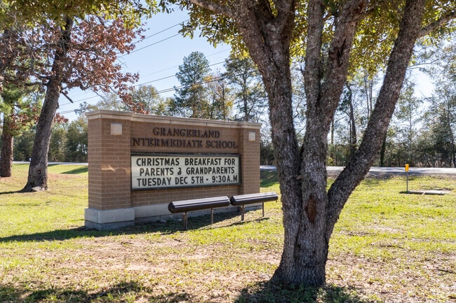 The front sign displays school announcements.