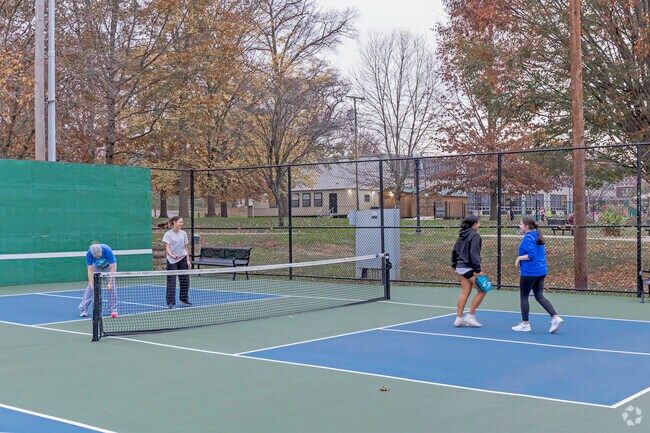 Westwood residents enjoying a game of pickleball on a beautiful day.