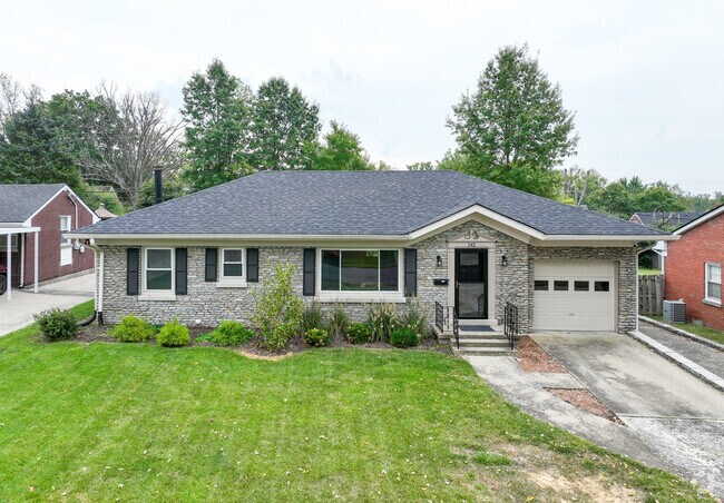 A renovated ranch-style home with a garage in Idle Hour