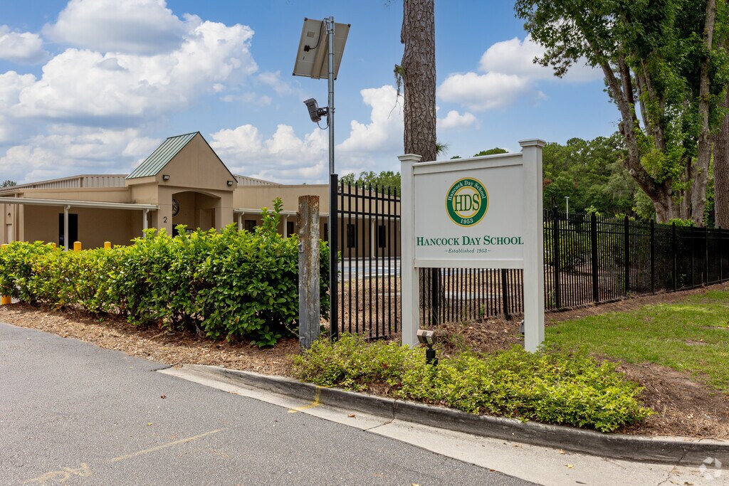 Hancock Day School has a large fenced campus with outdoor play areas in Savannah.