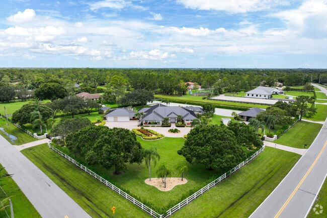 Estate-style family home with farmland and horses in Paddock Park, Wellington.