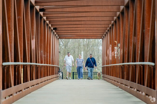 Ainsworth Park locals cross the Huron River using the Heritage Bridge.