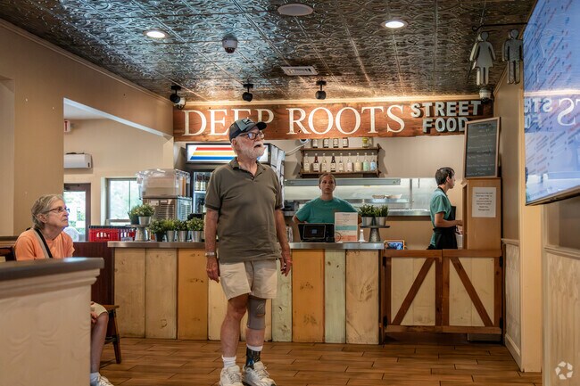 Deep Roots Street Food features a diverse menu with items such as sandwiches and coffee.