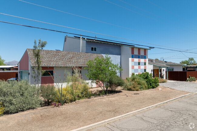 Modern lofts stand tall against smaller pueblos in Barrio San Antonio.