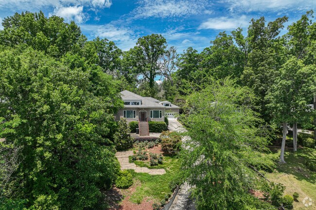 Waterfront Lakemont homes overlook Lake Olmstead with mature landscaping.