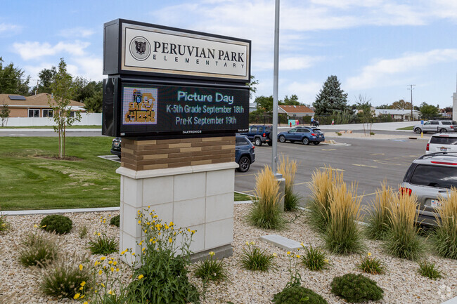 Peruvian Park Elementary has an electronic sign with a cement and brown brick base.