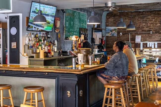 Grab a slice at Zella's Pizzeria in Hollins Market.