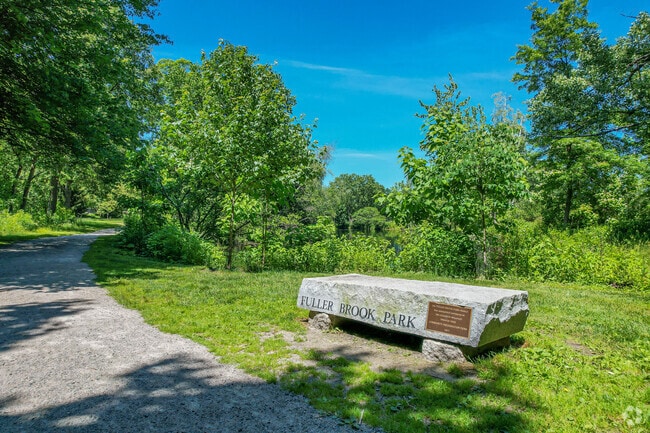 Brook Path features benches along the pond in Dana Hall.