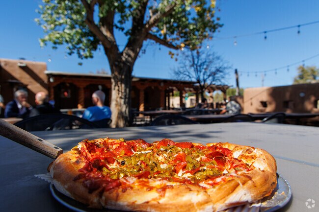 Residents of Corrales adore Village Pizza's quaint patio.