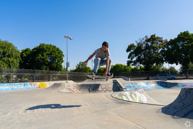 A skater lands a trick at Rotary Park’s skate park in North Madera.