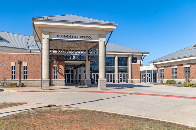Mustang High School's main entrance where visitors must check in.