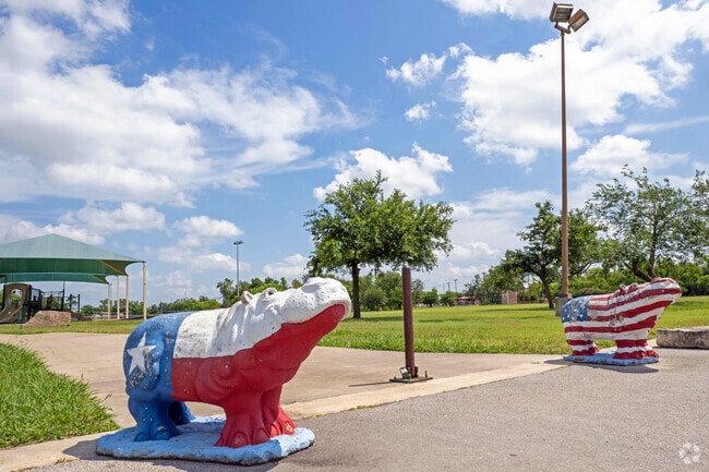Find spirited hippos welcoming at the park entrance.