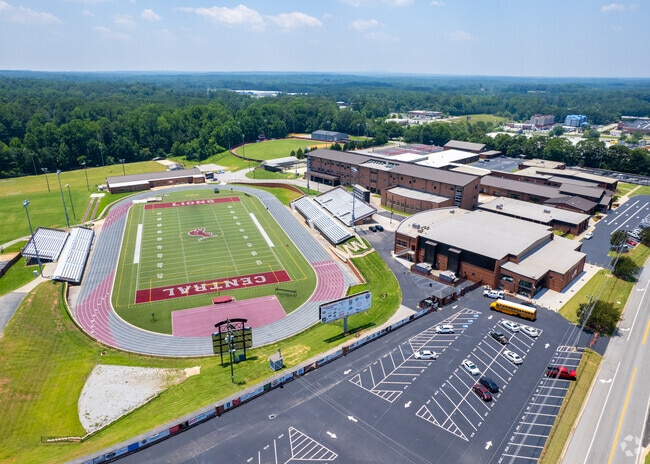Central High School has a large campus with green landscapes.